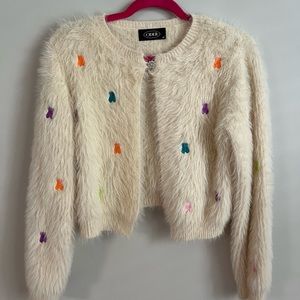 Cream/beige Short Bear Print Cardigan in size medium.